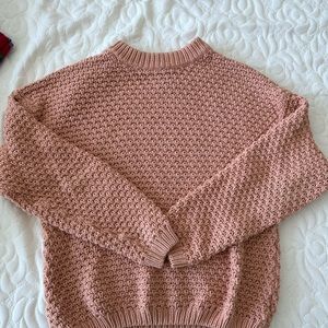 Coral colored knitted sweater